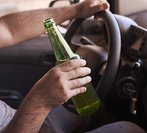 bottle beer man s hands driving car daytime