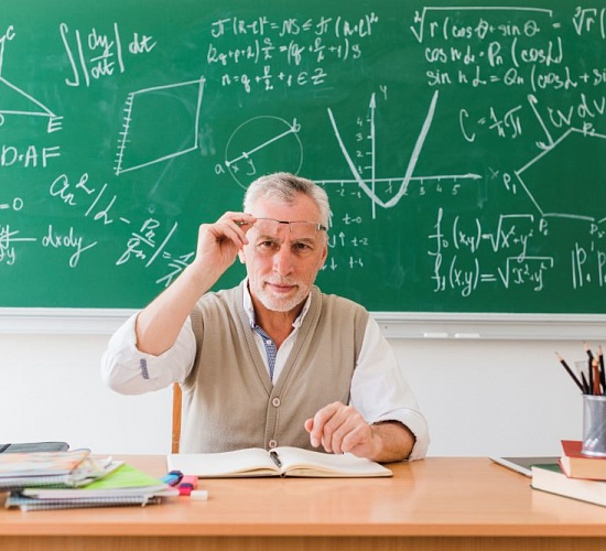 smiling old professor maths classroom